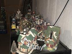 33 piece set Ceramic Christmas Village Lighted Toy Shop and Figures