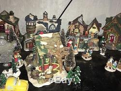 33 piece set Ceramic Christmas Village Lighted Toy Shop and Figures