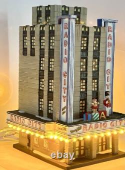 Dept 56 Christmas in City Series Radio City Music Hall & Handsom Cab