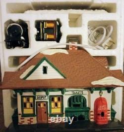 Dept 56 Village Animated Skating Pond with all accessories shown