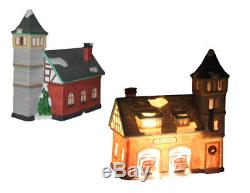 Eleven-piece Christmas Village lighted porcelain figurines
