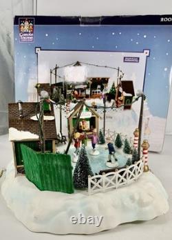 LEMAX Carole Towne Pine Ridge Ice Rink Animated Holiday Village Lights & Sound