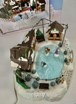 LEMAX Carole Towne Pine Ridge Ice Rink Animated Holiday Village Lights & Sound