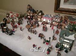 Lighted Christmas Village Animated Skating Pond 11 houses, 200 figures, more